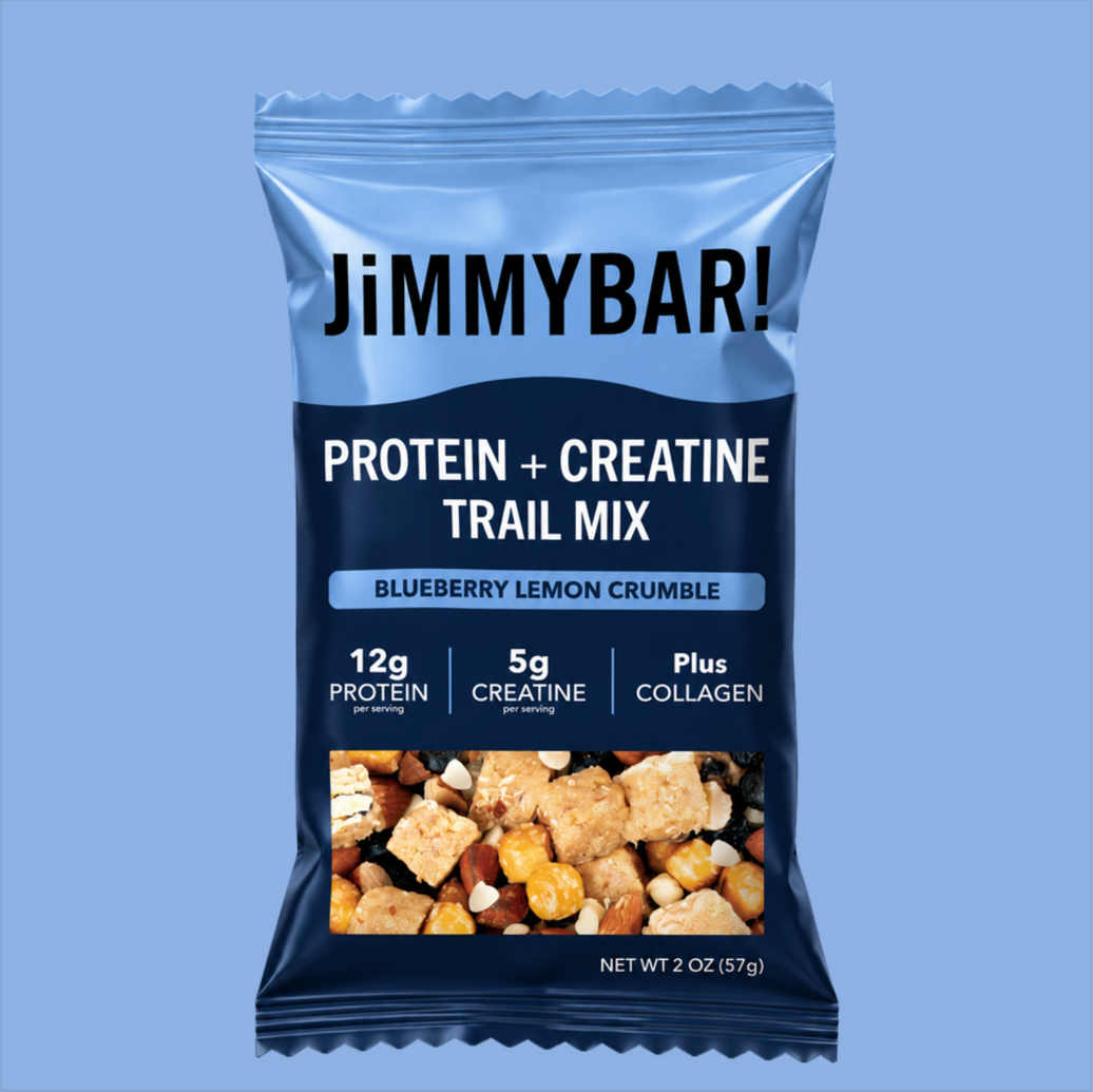 A 2 oz bag of Jimmybar! Protein + Creatine Trail Mix in Blueberry Lemon Crumble flavor, shown against a solid light blue background.