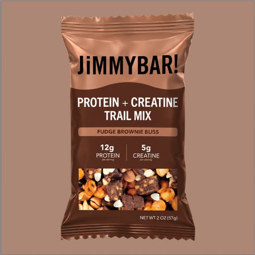 A 2 oz bag of Jimmybar! Protein + Creatine Trail Mix in Fudge Brownie Bliss flavor, shown against a solid taupe background.