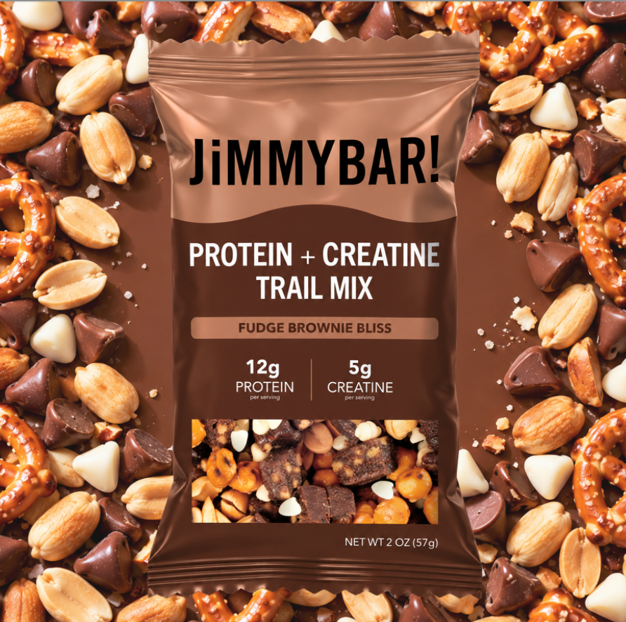 A 2 oz bag of JimmyBar! Protein + Creatine Trail Mix (Fudge Brownie Bliss) centered against a background of the same trail mix ingredients, including pretzels, almonds, chocolate, and brownie pieces.