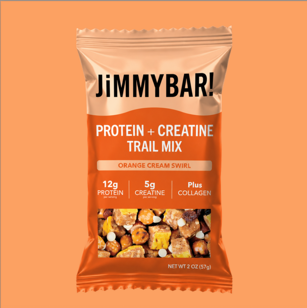 A package of JimmyBar! Protein + Creatine Trail Mix in Orange Cream Swirl flavor, shown against a solid orange background.